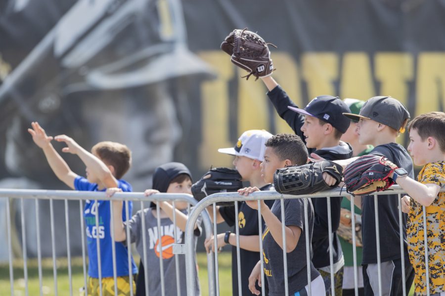 Young fans wait to see who will get to keep a foul ball during the afternoon Iowa vs Rutgers game at Duane Banks Field on Saturday, April 7, 2019. The Hawkeyes defeated the Scarlet Knights 9-5. 