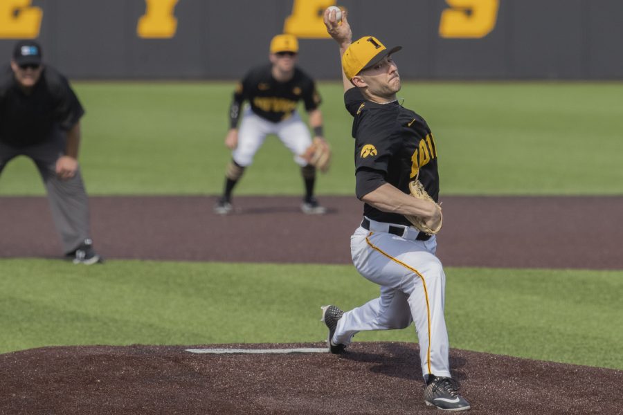 Iowa pitcher Cam Baumann throws a pitch during the fifth inning of the afternoon Iowa vs Rutgers game at Duane Banks Field on Saturday, April 7, 2019. The Hawkeyes defeated the Scarlet Knights 9-5. 