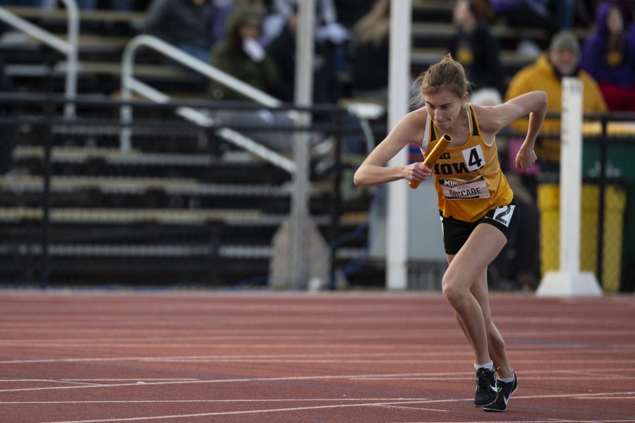 Iowa distance runner Grace McCabe starts the first leg of the 4x400m relay at the Musco Twilight Invitational at the Cretzmeyer Track on Saturday, April 13, 2019. The Iowa relay team finished sixth with a time of 4:22:14. The Hawkeyes won 10 events during the meet. The Iowa women ranked first with 183 points, and the men ranked fifth 76 points.