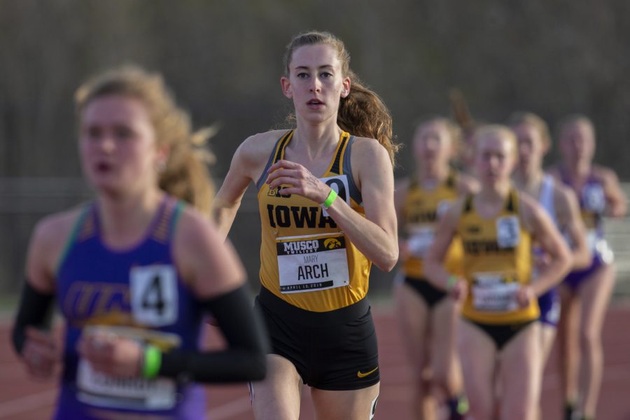 Iowa distance runner Mary Arch makes a move during the 3000m run at the Musco Twilight Invitational at the Cretzmeyer Track on Saturday, April 13, 2019. Arch finished fourth with a time of 10:23:58. The Hawkeyes won 10 events during the meet. The Iowa women ranked first with 183 points, and the men ranked fifth 76 points.