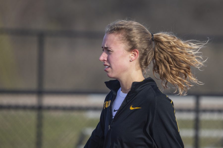 Iowa distance runner Megan Schott warms up for the 1500m run at the Musco Twilight Invitational at the Cretzmeyer Track on Saturday, April 13, 2019. Schott finished first with a time fo 4:33:68. The Hawkeyes won 10 events during the meet. The Iowa women ranked first with 183 points, and the men ranked fifth 76 points.