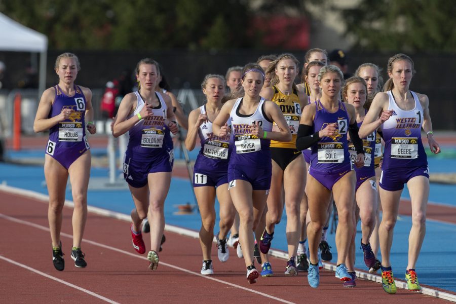 Iowa distance runner Jessica McKee sits in the middle of the pack during the 3000m run at the Musco Twilight Invitational at the Cretzmeyer Track on Saturday, April 13, 2019. McKee finished third with a time of 10:20:18. The Hawkeyes won 10 events during the meet. The Iowa women ranked first with 183 points, and the men ranked fifth 76 points.