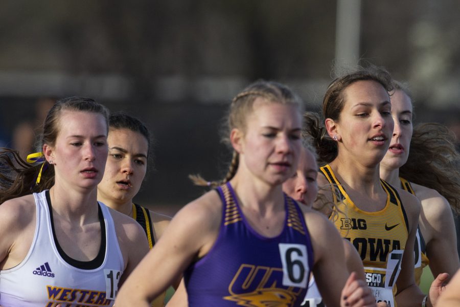 Iowa distance runners pack together during the 3000m run at the Musco Twilight Invitational at the Cretzmeyer Track on Saturday, April 13, 2019. The Hawkeyes won 10 events during the meet. The Iowa women ranked first with 183 points, and the men ranked fifth 76 points.