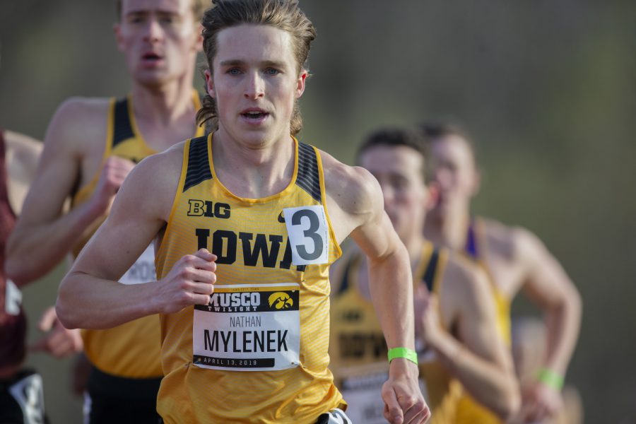 Iowa distance runner Nathan Mylenek leads the pack of the 1500m run at the Musco Twilight Invitational at the Cretzmeyer Track on Saturday, April 13, 2019. Mylenek won the race with a time 3:52:06. The Hawkeyes won 10 events during the meet. The Iowa women ranked first with 183 points, and the men ranked fifth 76 points.