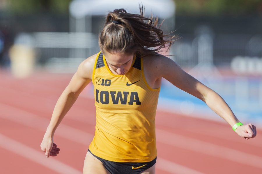 Iowa sprinter Talia Buss crosses the finish during the 400m dash at the Musco Twilight Invitational at the Cretzmeyer Track on Saturday, April 13, 2019. Buss finished second with a time of 55.85. The Hawkeyes won 10 events during the meet. The Iowa women ranked first with 183 points, and the men ranked fifth 76 points.