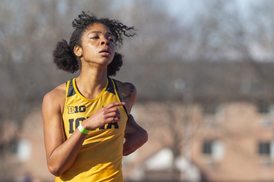 Iowa sprinter Mika Cox decelerates after crossing the finish of the 400m dash at the Musco Twilight Invitational at the Cretzmeyer Track on Saturday, April 13, 2019. Cox finished ninth with a time of 58.95. The Hawkeyes won 10 events during the meet. The Iowa women ranked first with 183 points, and the men ranked fifth 76 points.