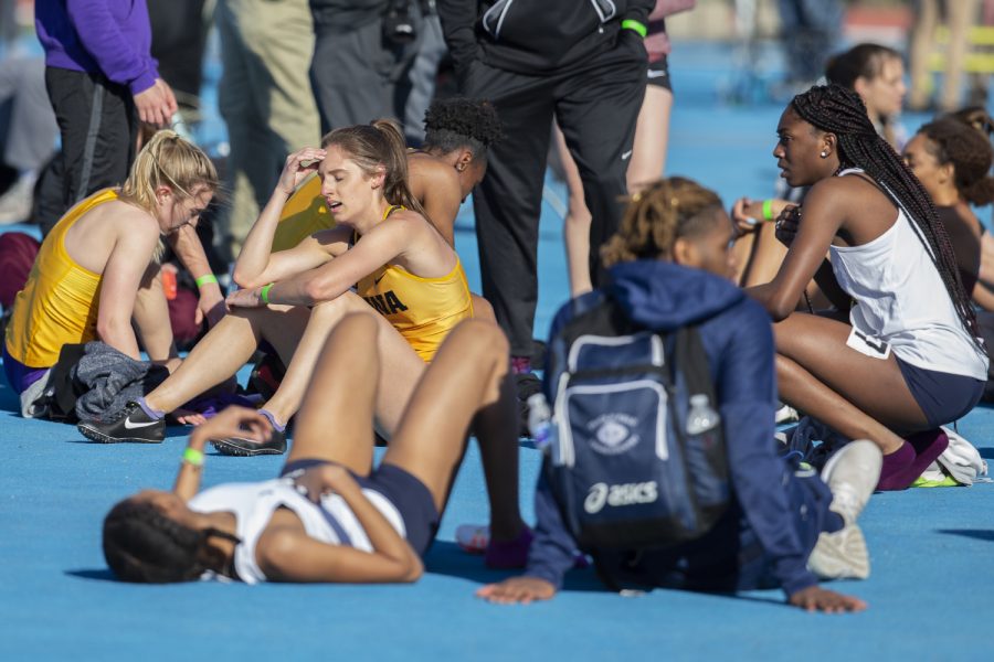 Iowa sprinter Talia Buss recovers after the 400m dash at the Musco Twilight Invitational at the Cretzmeyer Track on Saturday, April 13, 2019. Buss finished second with a time of 55.85. The Hawkeyes won 10 events during the meet. The Iowa women ranked first with 183 points, and the men ranked fifth 76 points.