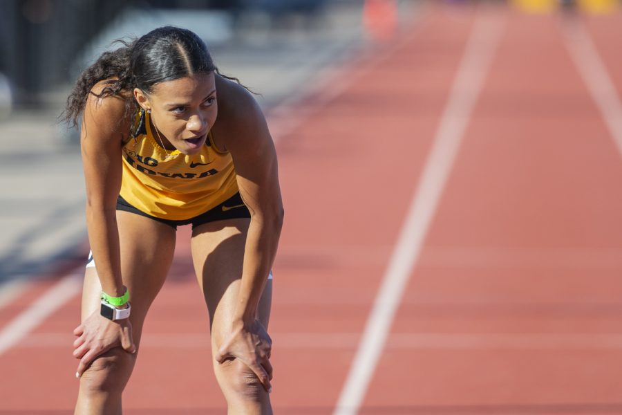 Iowa sprinter Alexis Gay recovers after the 400m dash at the Musco Twilight Invitational at the Cretzmeyer Track on Saturday, April 13, 2019. Gay finished eleventh with a time of 59.35. The Hawkeyes won 10 events during the meet. The Iowa women ranked first with 183 points, and the men ranked fifth 76 points.