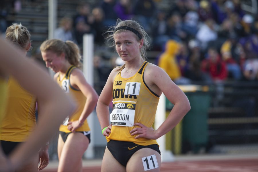 Iowa distance runner Emma Gordon checks her time after finishing the 1500m run at the Musco Twilight Invitational at the Cretzmeyer Track on Saturday, April 13, 2019. Gordon finished seventh with a time of 4:50:86. The Hawkeyes won 10 events during the meet. The Iowa women ranked first with 183 points, and the men ranked fifth 76 points.