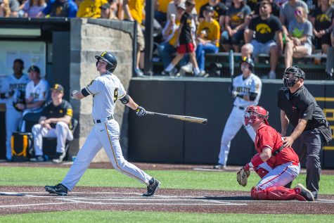 Iowa outfielder Ben Norman watches the ball after making contact during a baseball game between Iowa and Nebraska at Duane Banks Field on Saturday, April 20, 2019. The Hawkeyes defeated the Cornhuskers, 17-9.