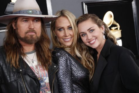 From left, Billy Ray Cyrus, Tish Cyrus, and Miley Cyrus arrive at the 61st Grammy Awards at Staples Center in Los Angeles on Sunday, Feb. 10, 2019. (Marcus Yam/Los Angeles Times/TNS)