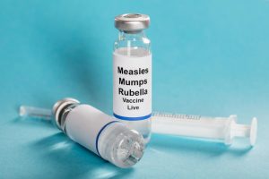 Measles mumps rubella vaccine vials with syringe