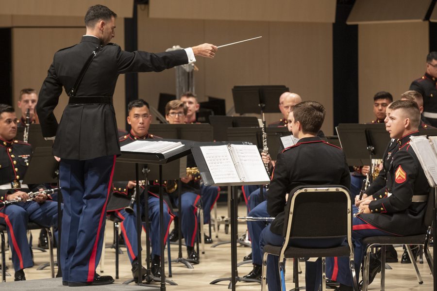 Warrant Officer Alex Panos conducts the band during the concert featuring the Marine Core Band concert at Voxman Music Building on Monday, April 15, 2019. 