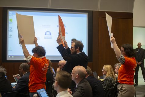 Faculty Forward members protest during the state Board of Regents meeting in the Levitt Center on Thursday, April 18, 2019.
