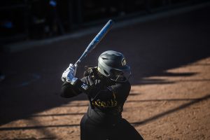 Iowa infielder Donirae Mayhew prepares to swing the bat during the game against Illinois at the Bob Pearl Softball Field on Saturday, April 13, 2019. The Hawkeyes defeated the Fighting Illini 4-3.