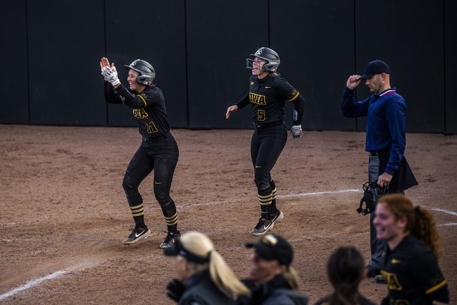 Iowa+pitcher+Mallory+Kilian+and+infielder+Sydney+Owens+cheer+after+Iowa+scores+the+winning+run+during+the+game+against+Illinois+at+the+Bob+Pearl+Softball+Field+on+Saturday%2C+April+13%2C+2019.+The+Hawkeyes+defeated+the+Fighting+Illini+4-3.