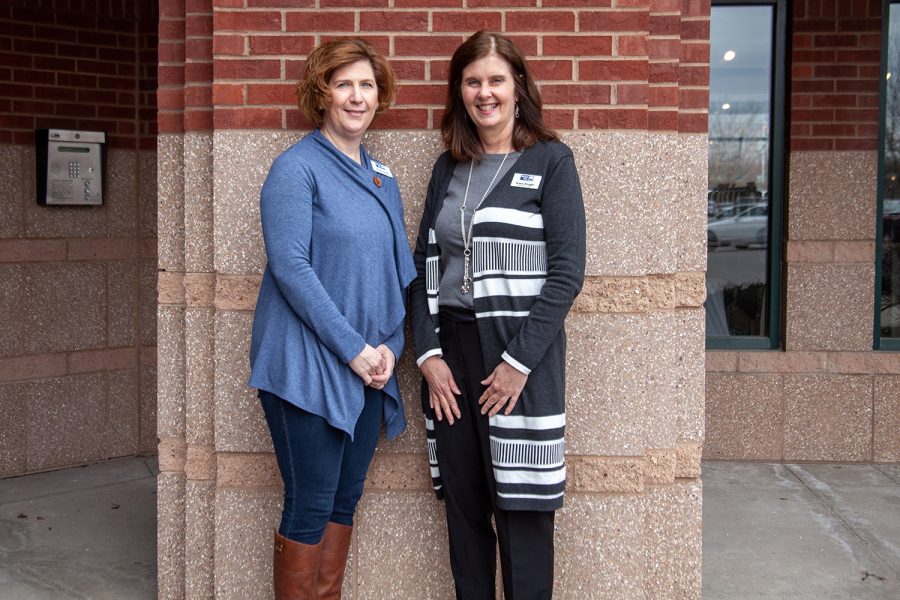 Trisha Smith (left,) and Katie Knight of United Way of Johnson and Washington Counties pose for a portrait outside of their Coralville office on Friday, March 29, 2019. The Johnson and Washington County United Way office, which is turning 100 this year, is planning a series of events aimed at garnering donations and spreading awareness for what the organization does.