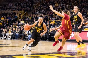 Iowa guard Tania Davis #11 dribbles into the lane during a womens basketball game against Iowa State University at Carver-Hawkeye Arena on Wednesday, Dec. 5, 2018. The Hawkeyes defeated the Cyclones 73-70.