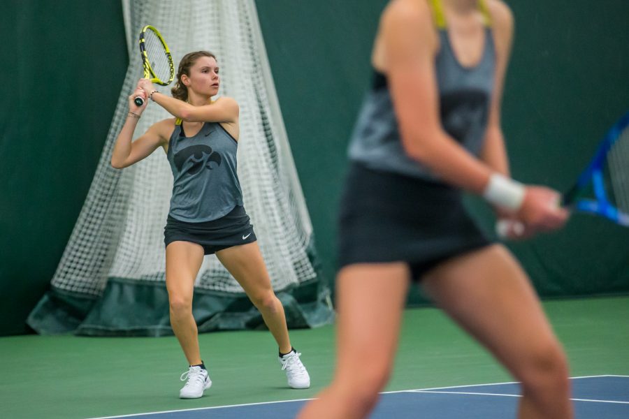 Iowa's Cloe Ruette hits a backhand during a women's tennis match between Iowa and Maryland at the HTRC on Sunday, April 7, 2019. The Hawkeyes defeated the Terrapins, 6-1.