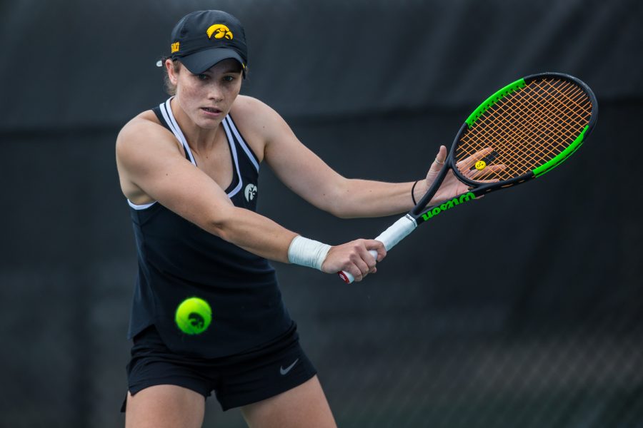 Iowas Elise van Heuvelen Treadwell hits a backhand during a womens tennis match between Iowa and Rutgers at the HTRC on Friday, April 5, 2019. The Hawkeyes defeated the Scarlet Knights, 6-1.