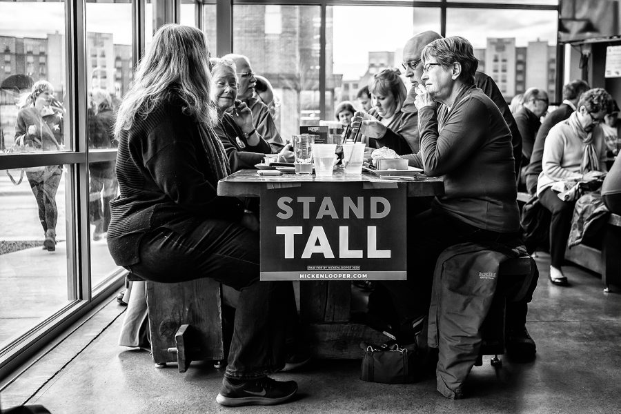 Hickenlooper supporters sit at a table at Backpocket Brewery in Coralville on Friday, April 12, 2019.