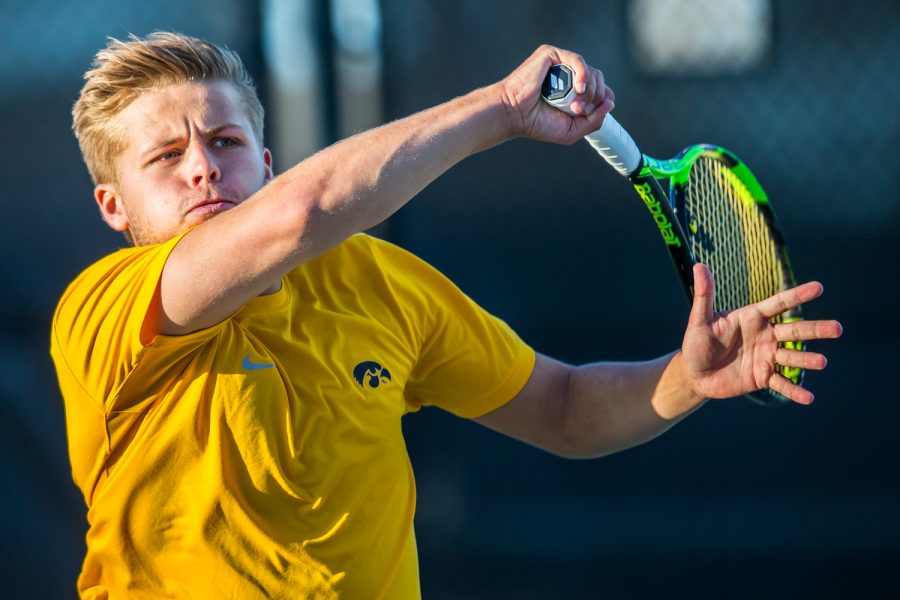 Iowas Will Davies hits a forehand during a mens tennis match between Iowa and Michigan State at the HTRC on Friday, April 19, 2019. The Hawkeyes defeated the Spartans, 5-2.