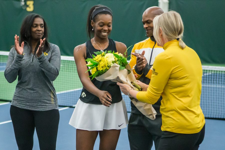 Iowa senior Adorabol Huckleby is honored by the team along with her family before a women's tennis match between Iowa and Nebraska at the HTRC on Saturday, April 13, 2019. The Hawkeyes, celebrating senior day, fell to the Cornhuskers, 4-2.