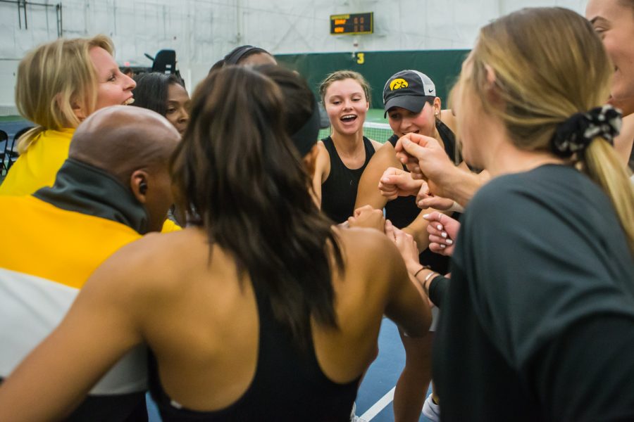 Iowa players huddle before a women's tennis match between Iowa and Nebraska at the HTRC on Saturday, April 13, 2019. The Hawkeyes, celebrating senior day, fell to the Cornhuskers, 4-2.