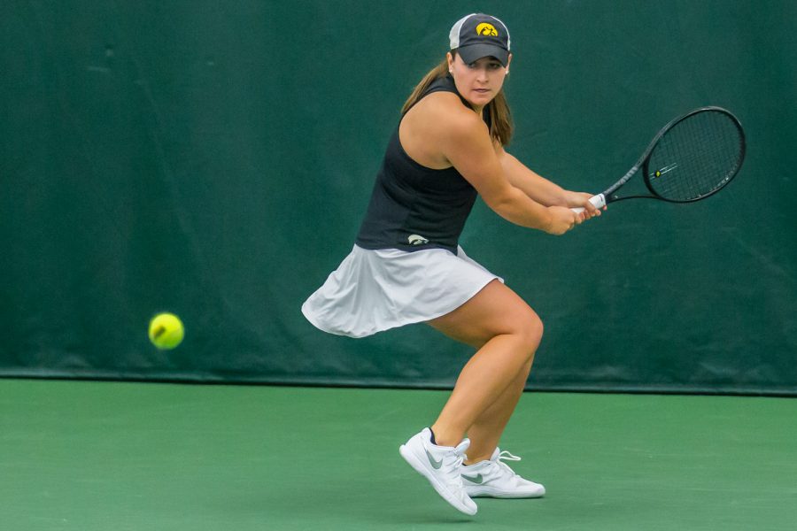 Iowa's Danielle Bauers hits a backhand during a women's tennis match between Iowa and Nebraska at the HTRC on Saturday, April 13, 2019. The Hawkeyes, celebrating senior day, fell to the Cornhuskers, 4-2.