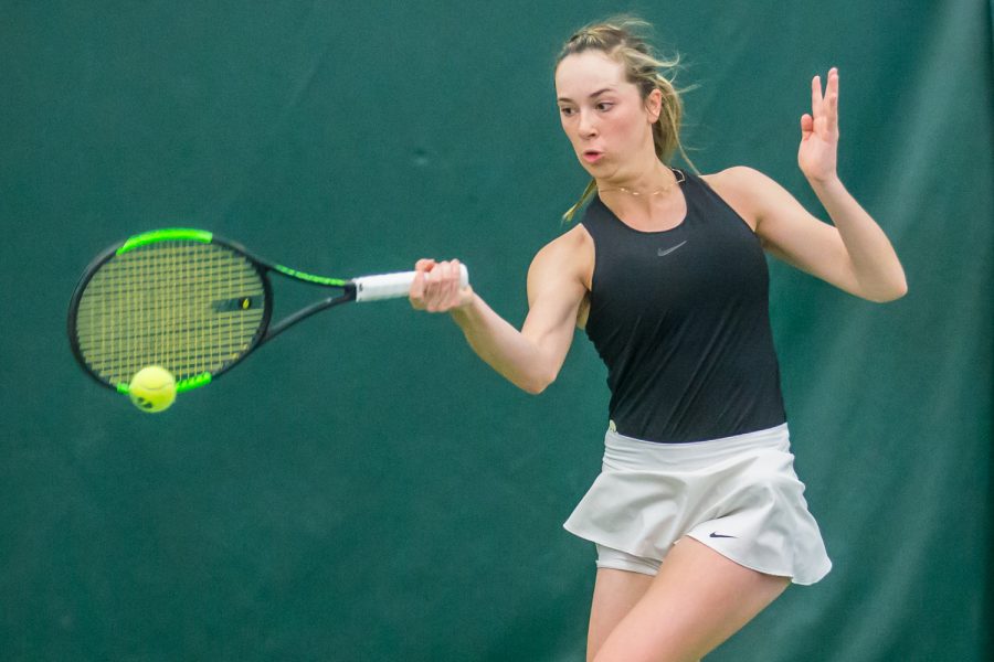 Iowa's Samantha Mannix hits a forehand during a women's tennis match between Iowa and Nebraska at the HTRC on Saturday, April 13, 2019. The Hawkeyes, celebrating senior day, fell to the Cornhuskers, 4-2.