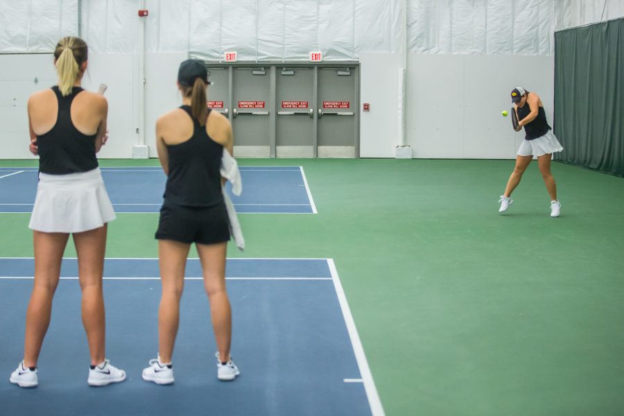 Iowa's Danielle Bauers hits a backhand during a women's tennis match between Iowa and Nebraska at the HTRC on Saturday, April 13, 2019. The Hawkeyes, celebrating senior day, fell to the Cornhuskers, 4-2.