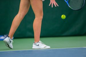 Iowas Sophie Clark prepares to serve during a womens tennis match between Iowa and Nebraska at the HTRC on Saturday, April 13, 2019. The Hawkeyes, celebrating senior day, fell to the Cornhuskers, 4-2.