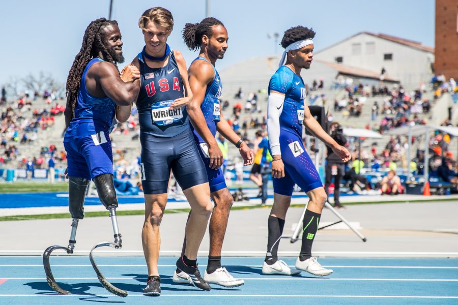 U.S. Paralympians William Woods (far left) and Tanner Wright congratulate each other after the 100m Paralympic Dash  at the 2019 Drake Relays in Des Moines, IA, on Friday, April 26, 2019.