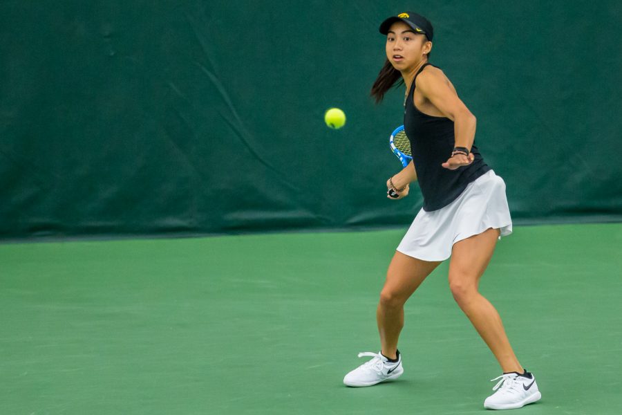 Iowa's Michelle Bacalla hits a forehand during a women's tennis match between Iowa and Nebraska at the HTRC on Saturday, April 13, 2019. The Hawkeyes, celebrating senior day, fell to the Cornhuskers, 4-2.