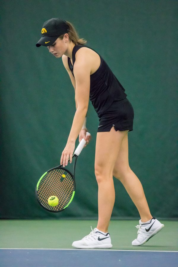 Iowa's Elise Van Heuvelen Treadwell prepares to serve during a women's tennis match between Iowa and Nebraska at the HTRC on Saturday, April 13, 2019. The Hawkeyes, celebrating senior day, fell to the Cornhuskers, 4-2.