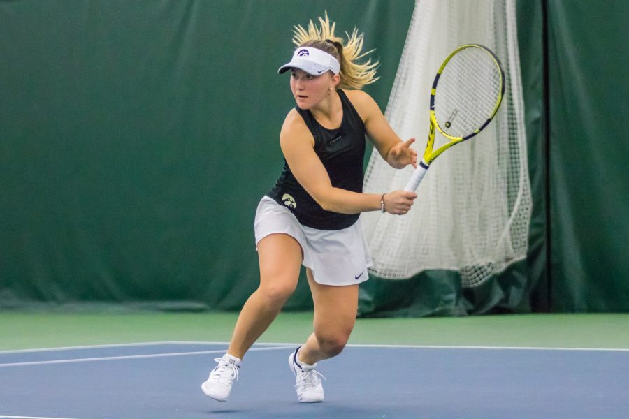 Iowas+Danielle+Burich+hits+a+backhand+during+a+womens+tennis+match+between+Iowa+and+Nebraska+at+the+HTRC+on+Saturday%2C+April+13%2C+2019.+The+Hawkeyes%2C+celebrating+senior+day%2C+fell+to+the+Cornhuskers%2C+4-2.