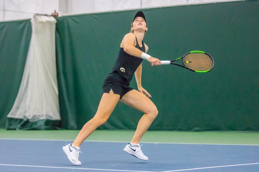 Iowa's Elise Van Heuvelen Treadwell watches the ball during a women's tennis match between Iowa and Nebraska at the HTRC on Saturday, April 13, 2019. The Hawkeyes, celebrating senior day, fell to the Cornhuskers, 4-2.