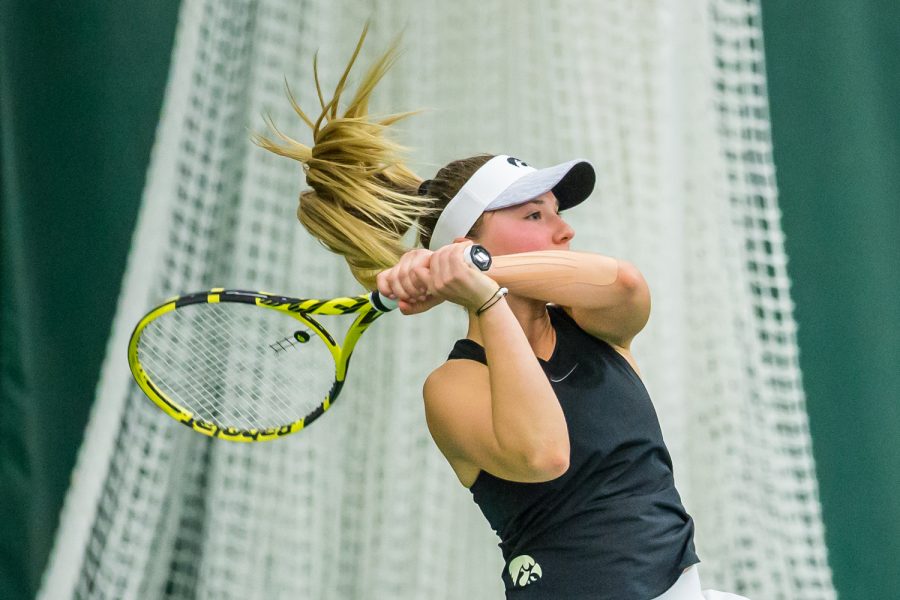 Iowa's Danielle Burich hits a backhand during a women's tennis match between Iowa and Nebraska at the HTRC on Saturday, April 13, 2019. The Hawkeyes, celebrating senior day, fell to the Cornhuskers, 4-2.