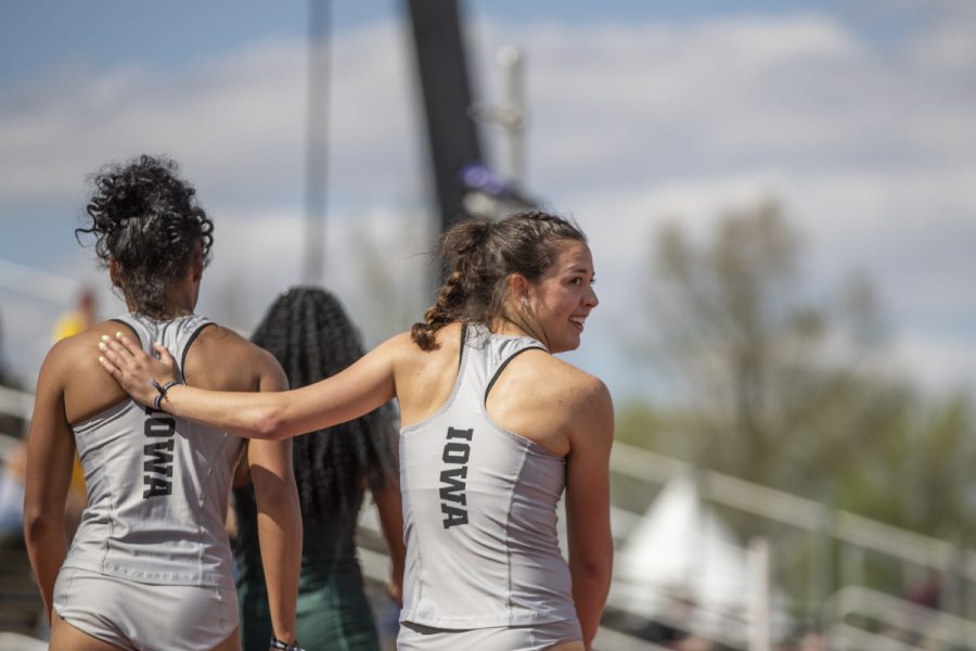 University of Iowa Heptathlete Jenny Kimbro congratulates teammate Tria Simmons after Simmons won their heat of the 200 meter run during the first day of the Big Ten Track and Field Outdoor Championships at Cretzmeyer Track on Friday, May 10, 2019. Simmons won the 200 meter run portion of the heptathlon with a time of 24.19 seconds.
