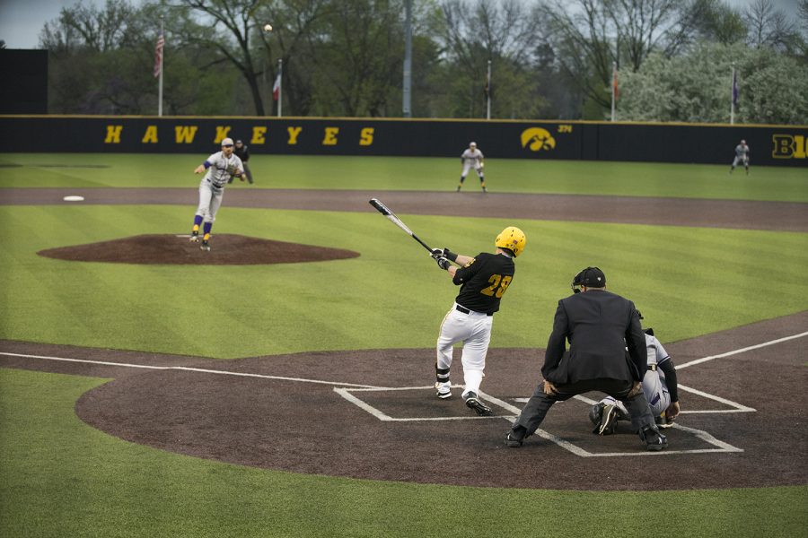 Iowa infielder Chris Whelan hits the ball at a baseball game against Northwestern Illinois at Duane Banks Field on May 1, 2019.