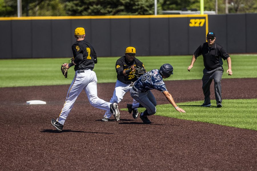 Iowa infielder Izaya Fullard runs toward UC Irvine infielder Adrian Damla in a pickle during the game against UC Irvine at Duane Banks Field on Saturday, May 4, 2019. The Hawkeyes defeated the Anteaters 1-0.