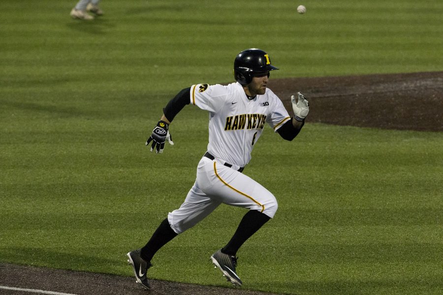 Iowa outfielder Justin Jenkins races the ball to first base during the game against Michigan State at the Duane Banks Baseball Stadium on Friday, May 10, 2019. The Hawkeyes defeated the Spartans 7-5.