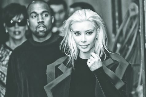 Kanye West and Kim Kardashian arrive at Balmain Fashion Show during Paris Fashion Week on March 5, 2015 in Paris, France. 