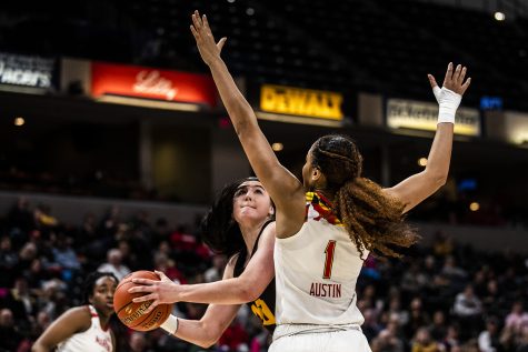 Iowa center Megan Gustafson prepares to shoot the ball past Maryland forward Shakira Austin during the womens Big Ten Championship basketball game vs. Maryland at Bankers Life Fieldhouse on Sunday, March 10, 2019. 