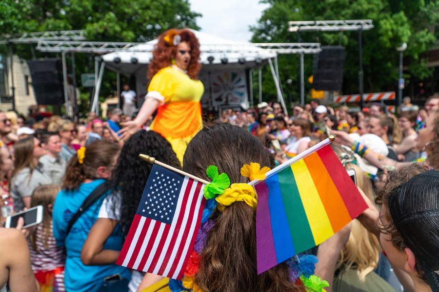 A crowd member watches the royalty show in Iowa City during the pride weekend on June 15, 2019.