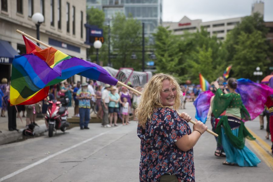 Lexi+Ridout%2C+a+parade+participant%2C+marches+on+Dubuque+St.+with+flag+in+hand+during+the+IC+Pride+Parade+on+Saturday%2C+June+17.+The+parade+is+apart+of+LBGT+Pride+Month%2C+established+in+1969+to+commemorate+the+Stonewall+riots.+%28Ben+Smith%2FThe+Daily+Iowan%29