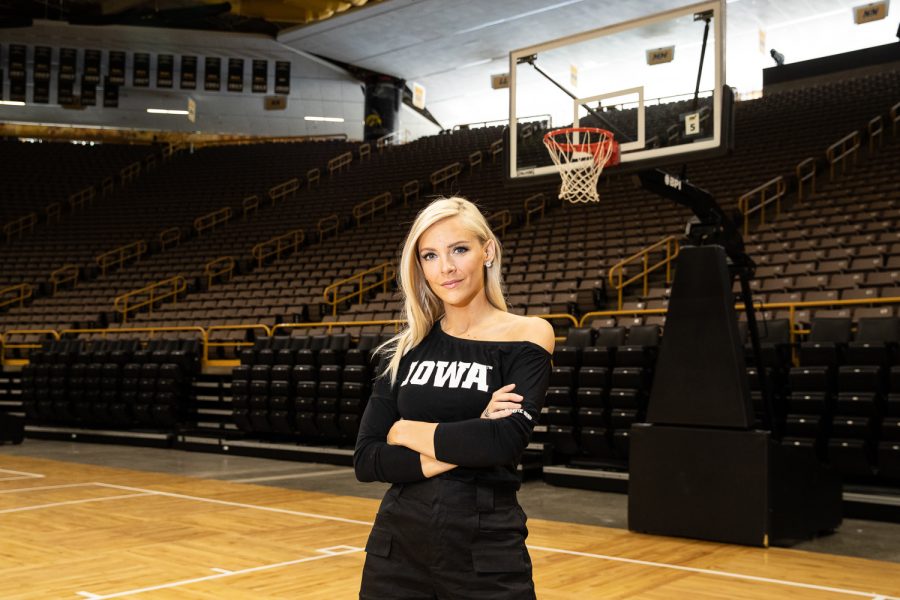 Hawkeye Sports host Laura Vandeberg poses for a portrait in Carver Hawkeye Arena on Thursday, June 13, 2019. (Wyatt Dlouhy/The Daily Iowan)