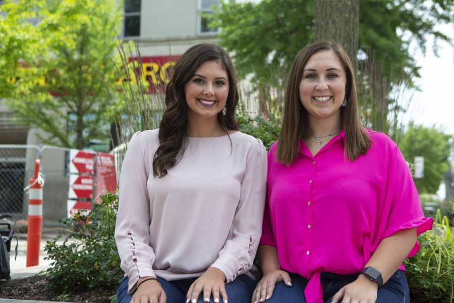 Kennedy Voss (left) and Taylor Williams (right) pose for a portrait on the Ped Mall on June 27, 2019. Voss and Williams started a business called Wanderlust Wraps to pay for their study abroad trip. (Katie Goodale/The Daily Iowan)
