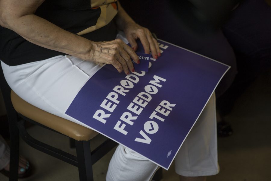 A supporter holds a sign during Senator Kamala Harris, D-CA, town hall event at Confluence Brewery in Des Moines on July 3, 2019. 