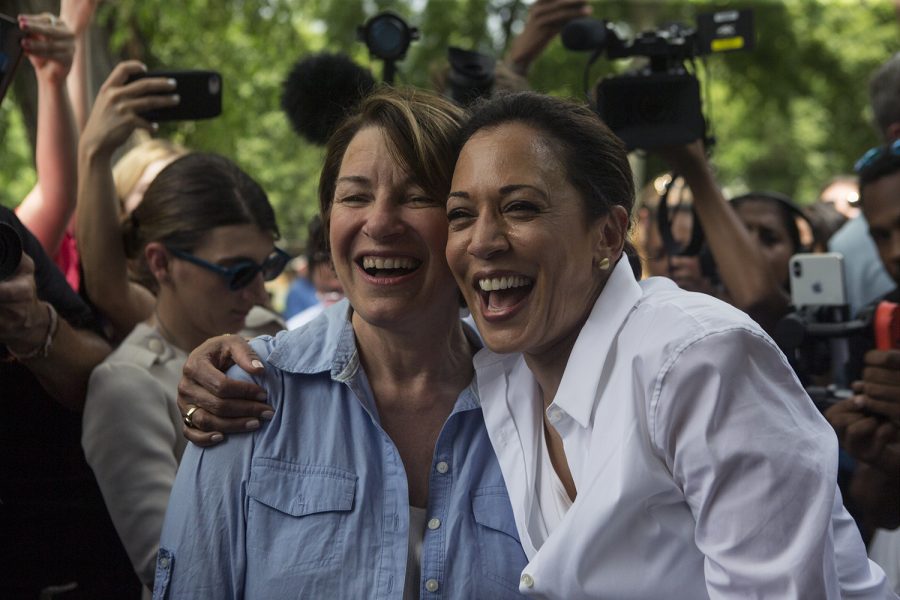 Senators Amy Klobuchar, D-MN,and Kamala Harris, D-CA, share a laugh during a 4th of July picnic hosted by the West Des Moines Democrats in Legion Park on July 3, 2019. 